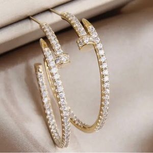 Nail head hoop earrings in gold with beautiful crystal.